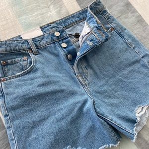 High waisted mid length jean shorts with button fly